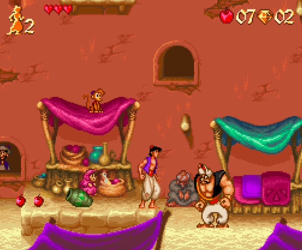 Aladdin confronting an Agrabah guard in the marketplace level of the original SNES game